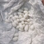 Lady fills a galvanized tub with rocks and floating lights. Everyone on my street keeps asking about this porch hack