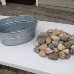 Lady paints river stones with green acrylics. Everyone is obsessed with this genius hack